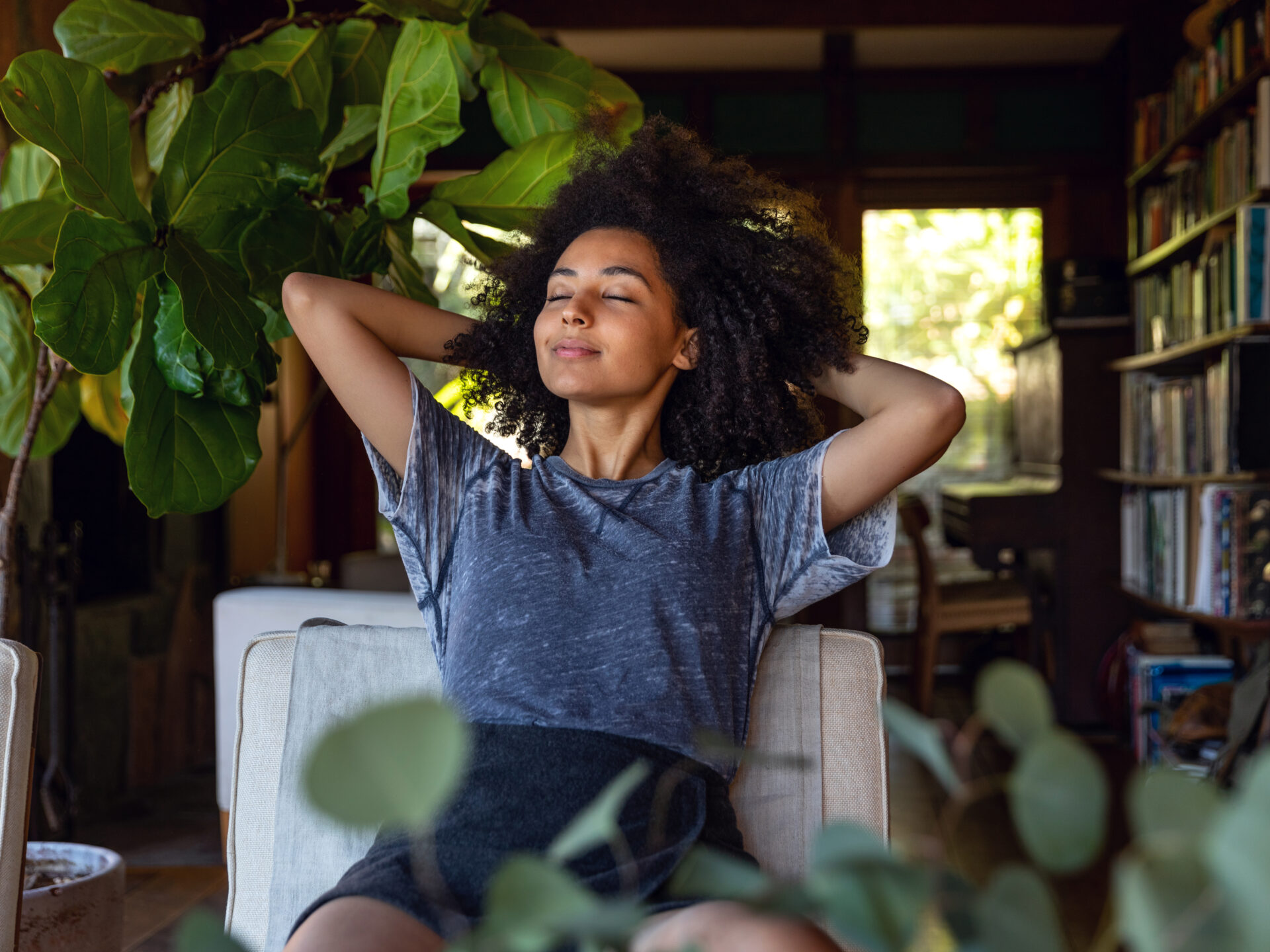 Young woman spending a relaxing day in her beautiful home - Lucky Ducts Cleaning Services
