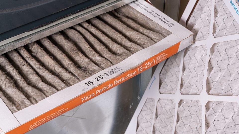 Replacing dirty furnace filter in home